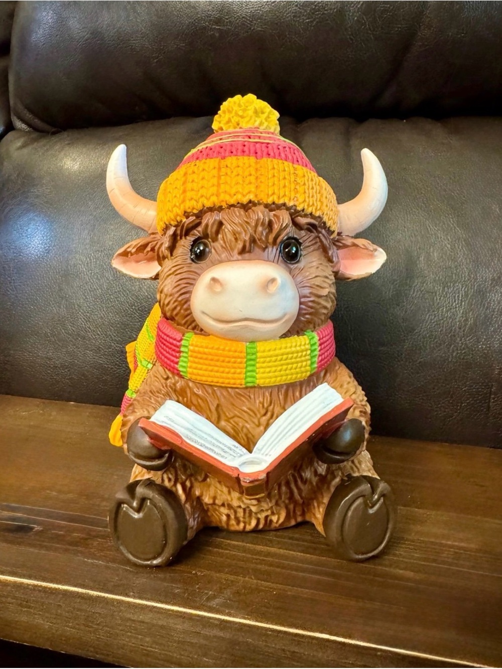 Brown Highland Cow Figurine with Yellow-Pink Knit Hat and Scarf